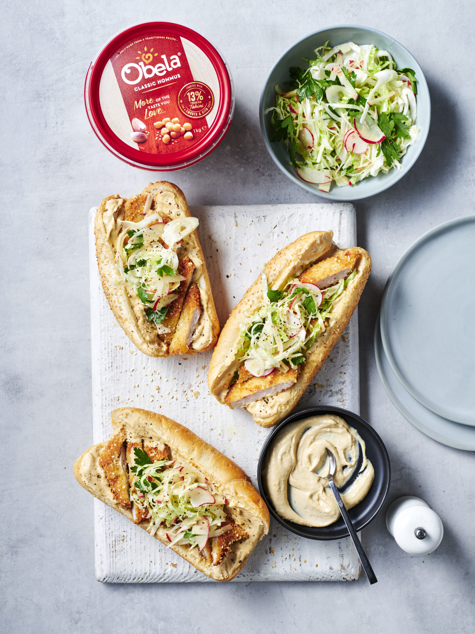 Pork schnitzel rolls with Obela Hommus mayo and slaw